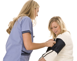 Nurse Taking Patients Blood Pressure