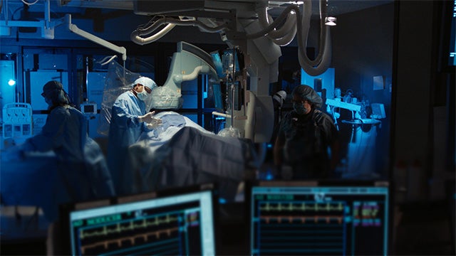 A group of doctors operating on a patient