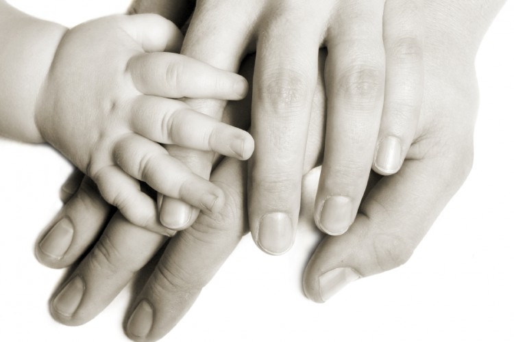 Mother and baby hands