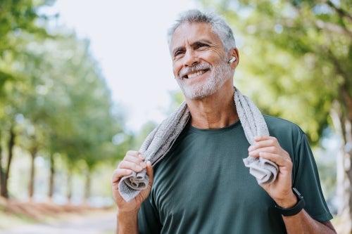 Man done exercising with towel around neck