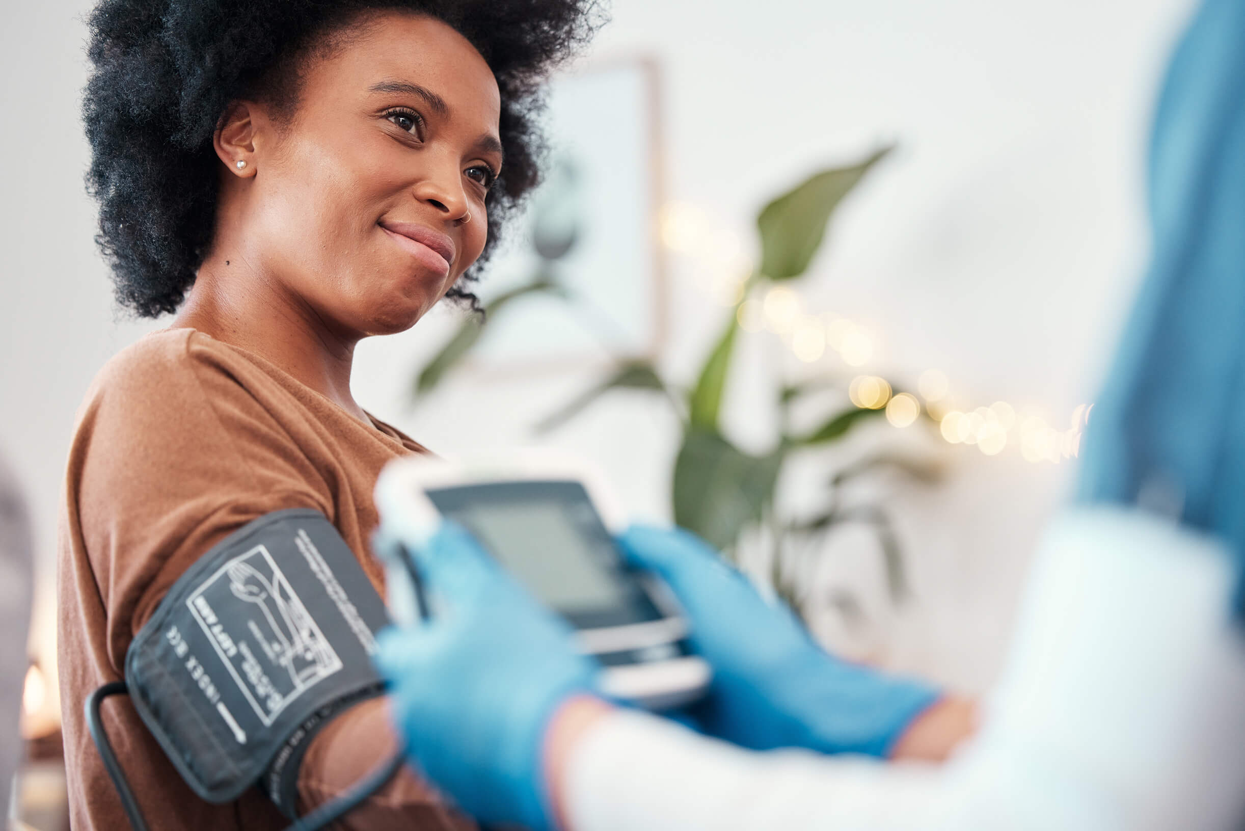 A woman having her blood pressure checked
