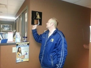 Bradley Kinkead rings a bell to signify his last chemotherapy treatment.