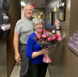 Sharon poses with her husband, John, as she rings the bell to celebrate her last day of chemotherapy.