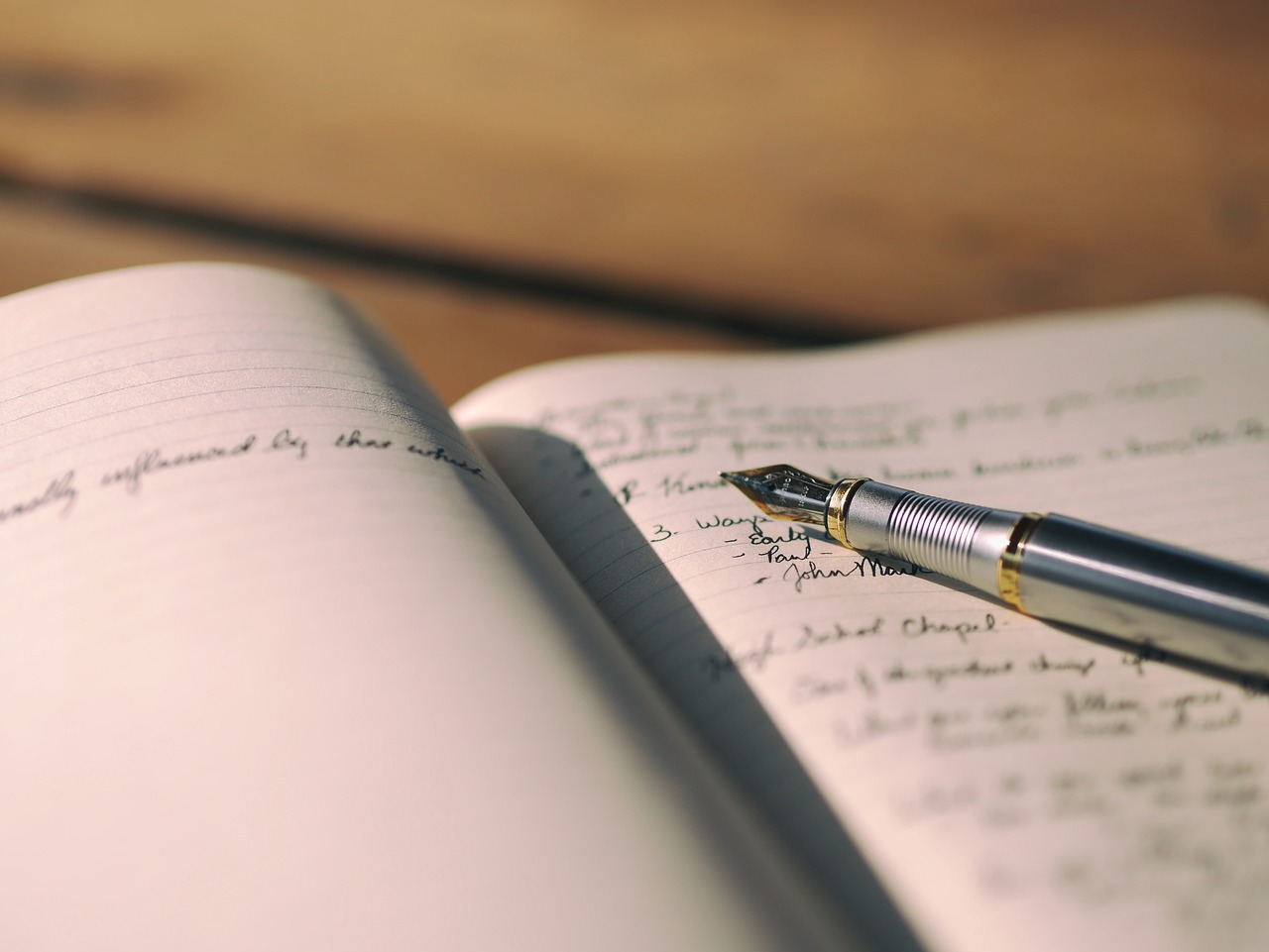 A notebook with writing produced by a fancy pen